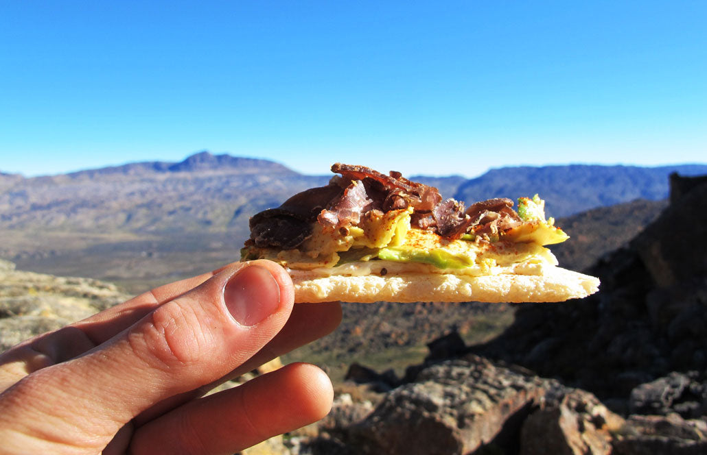 How is biltong typically consumed?